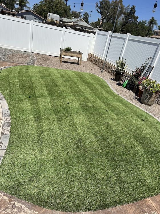 An oval artificial turf lawn cleaned and striped
